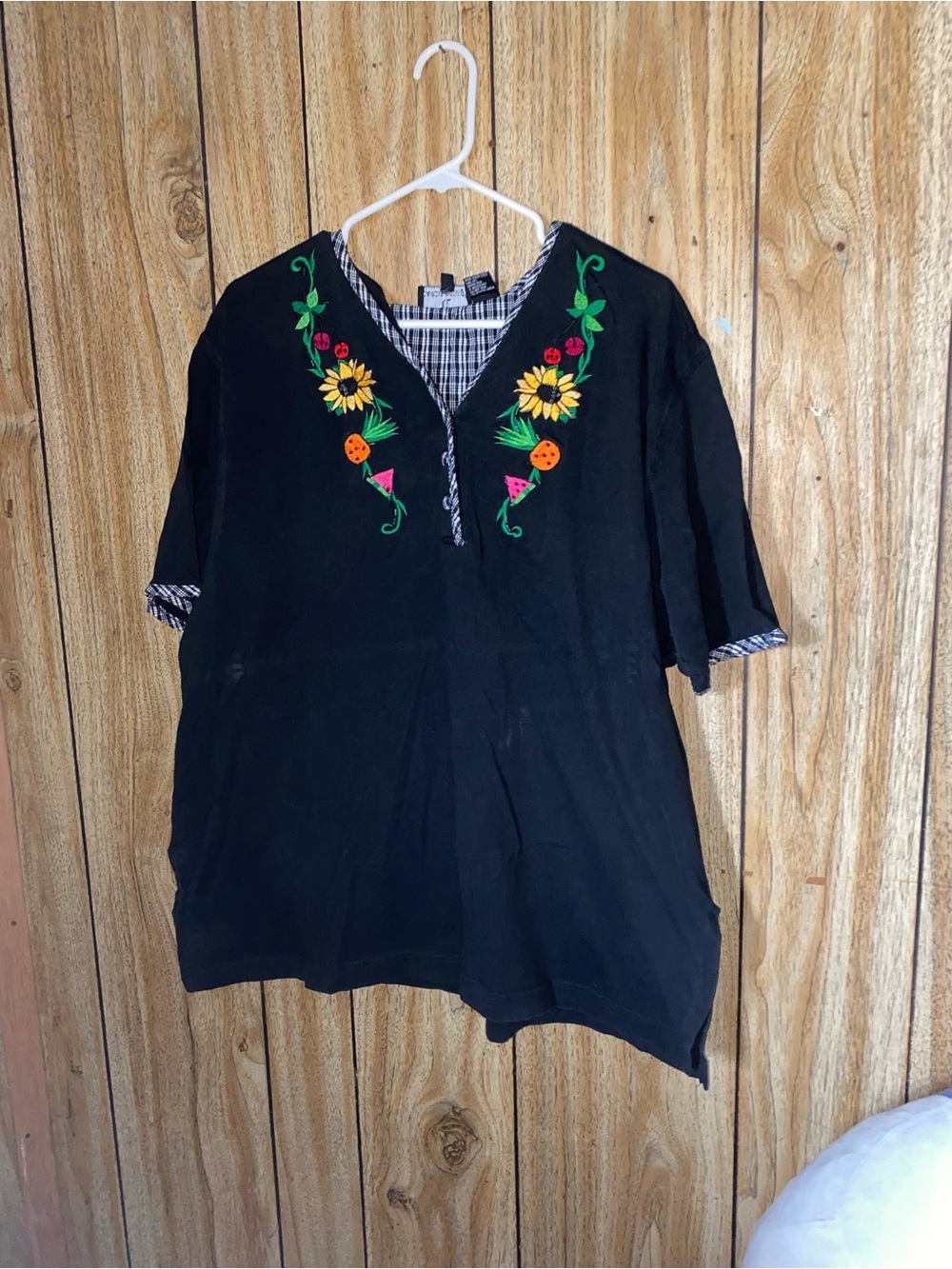 Floral embroidery and a split neck